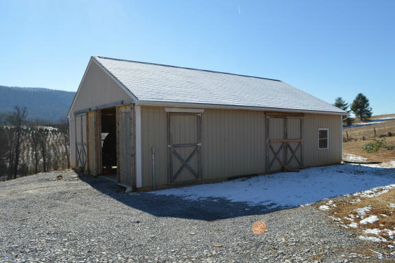 357 Sam Reed Road Northwest Floyd, VA 24091 - Photo 76 of 105 a view of a house with a wooden fence
