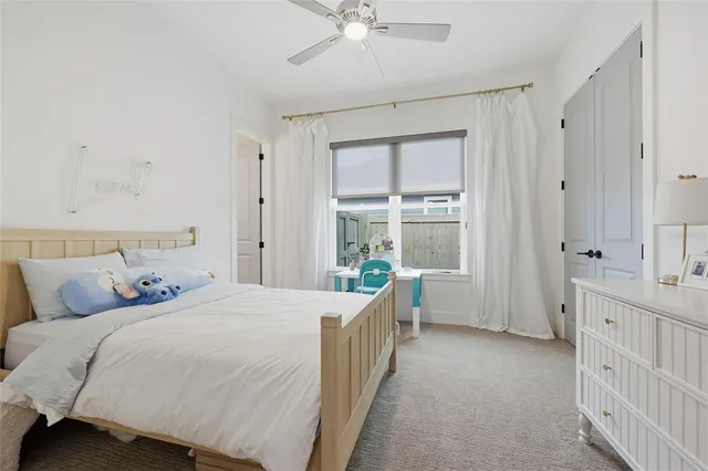 a bedroom with a bed and a table