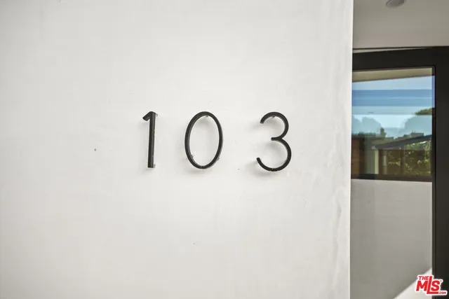 a bathroom with a shower and mirror