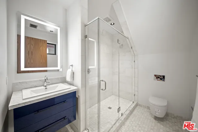 a kitchen with granite countertop a refrigerator and a sink