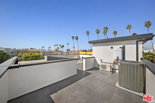 a view of a terrace with furniture and a potted plant