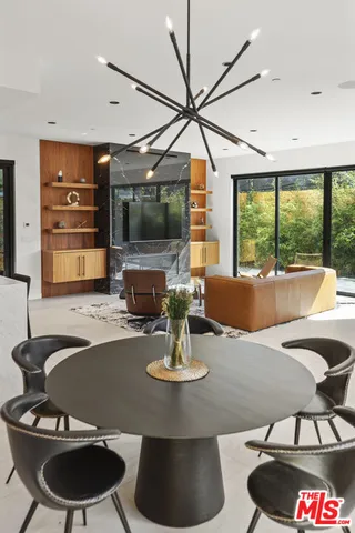 a kitchen with stainless steel appliances granite countertop a stove a refrigerator and a oven