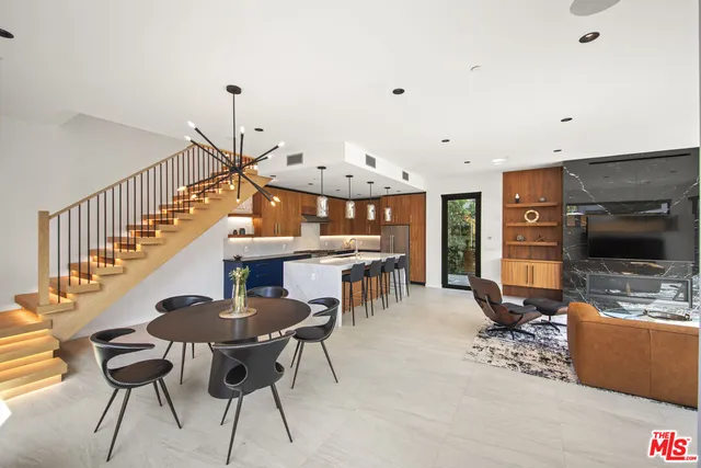 a view of a livingroom with furniture and flat screen tv