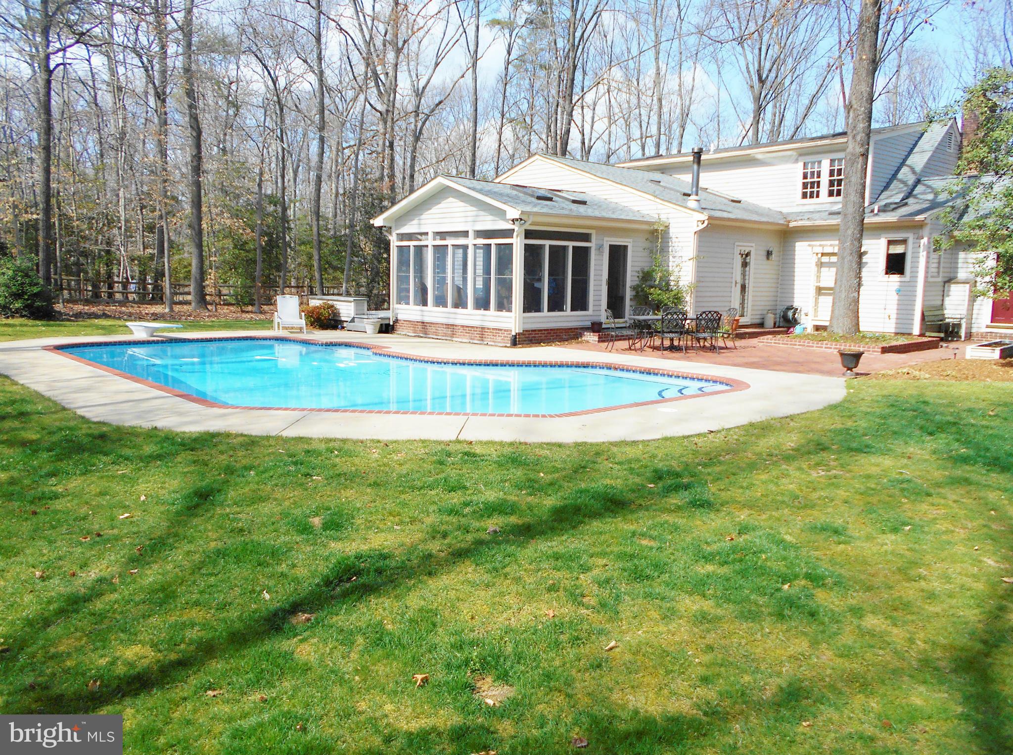 7415 Simms Landing Road Port Tobacco, MD 20677 - Photo 2 of 30 a view of a house with a swimming pool