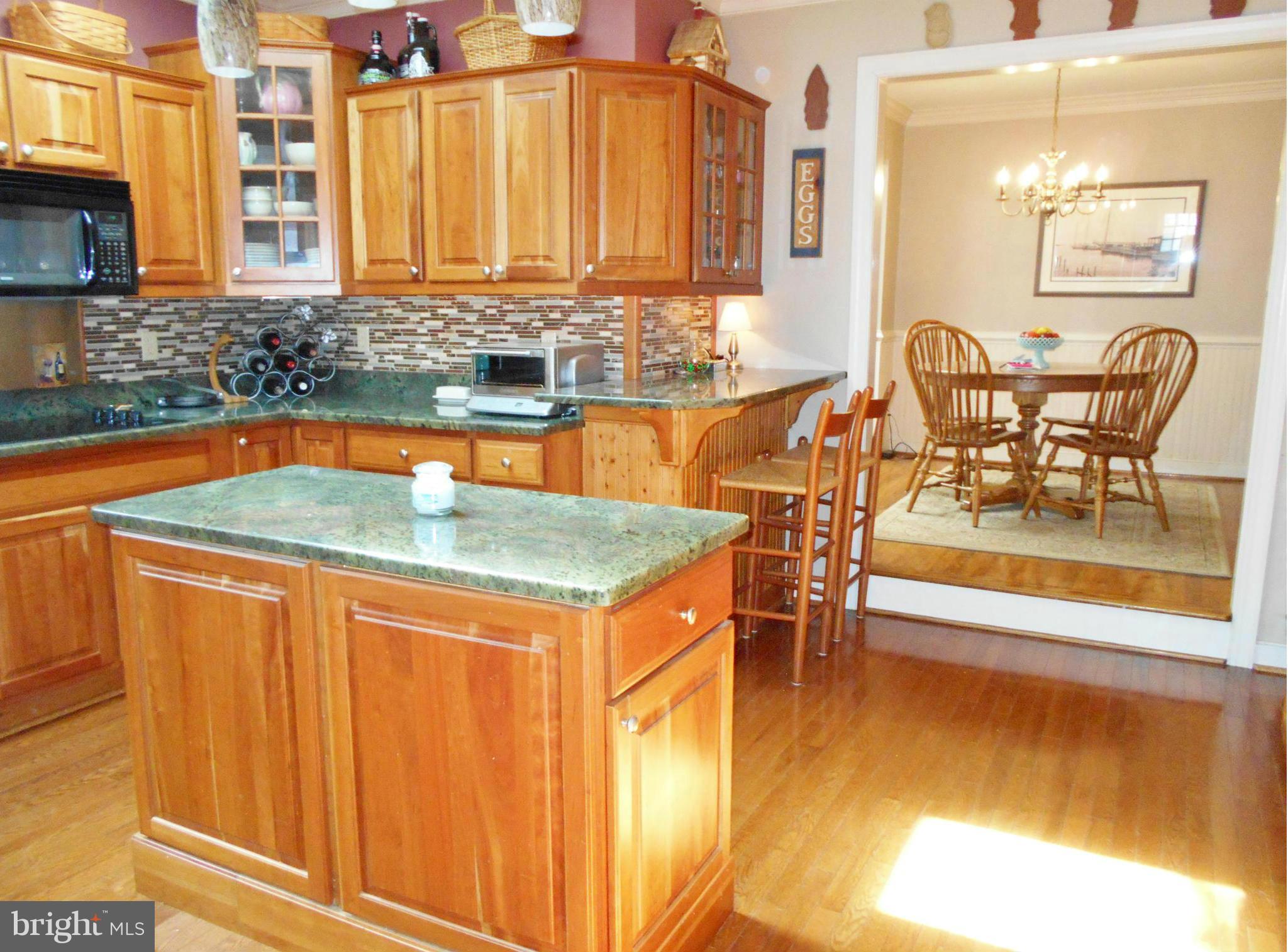 7415 Simms Landing Road Port Tobacco, MD 20677 - Photo 13 of 30 a dining table with chairs and window