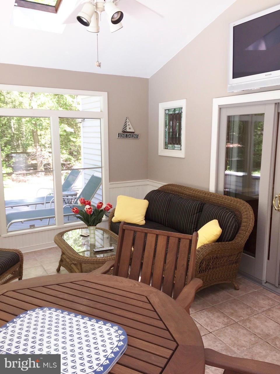 7415 Simms Landing Road Port Tobacco, MD 20677 - Photo 18 of 30 a bedroom with a bed and wooden floor