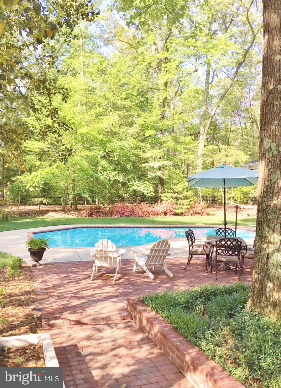 7415 Simms Landing Road Port Tobacco, MD 20677 - Photo 3 of 30 a view of a lake with a swimming pool