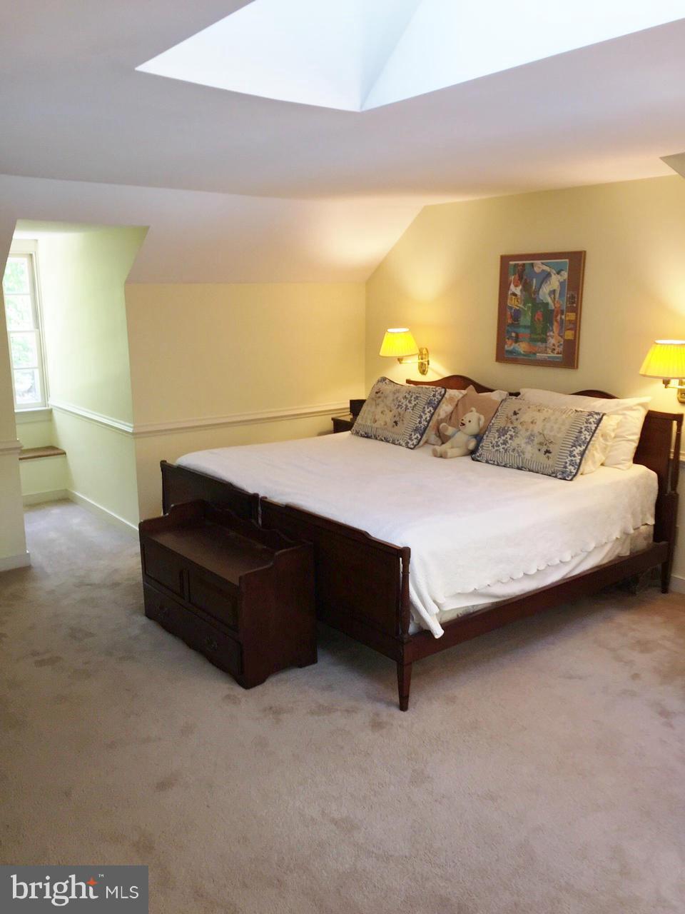 7415 Simms Landing Road Port Tobacco, MD 20677 - Photo 25 of 30 a bedroom with a bed and lamp