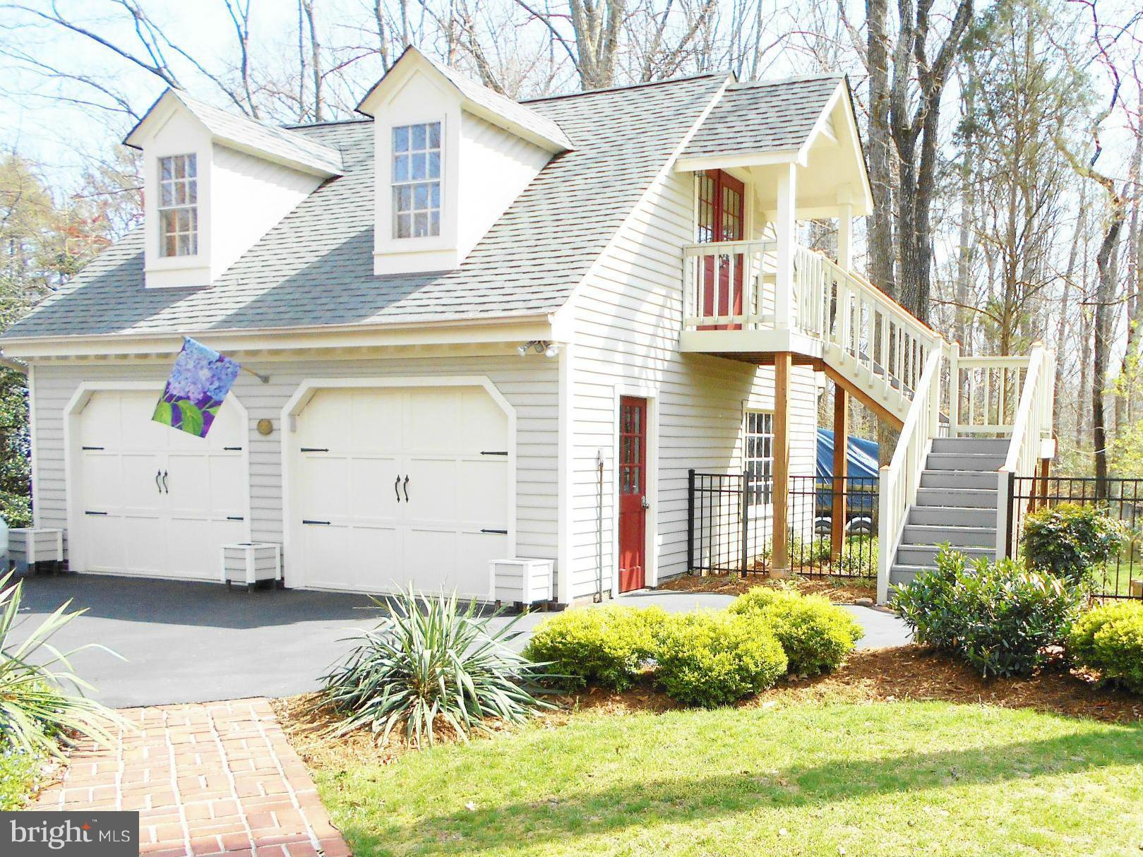 7415 Simms Landing Road Port Tobacco, MD 20677 - Photo 29 of 30 a front view of a house with garden