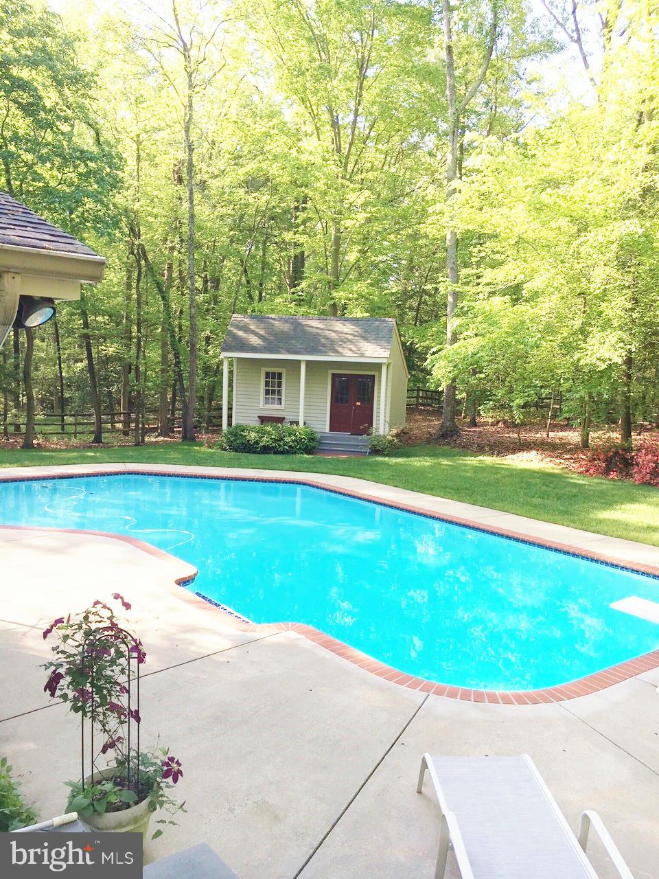 7415 Simms Landing Road Port Tobacco, MD 20677 - Photo 5 of 30 a view of a house with a swimming pool