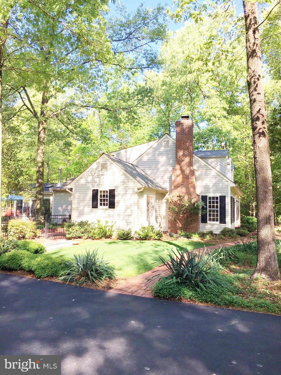 7415 Simms Landing Road Port Tobacco, MD 20677 - Photo 6 of 30 a house view with a garden space