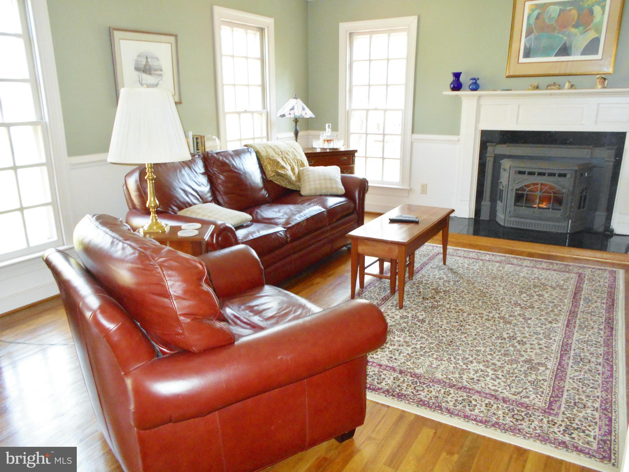 7415 Simms Landing Road Port Tobacco, MD 20677 - Photo 9 of 30 a living room with furniture and a fireplace
