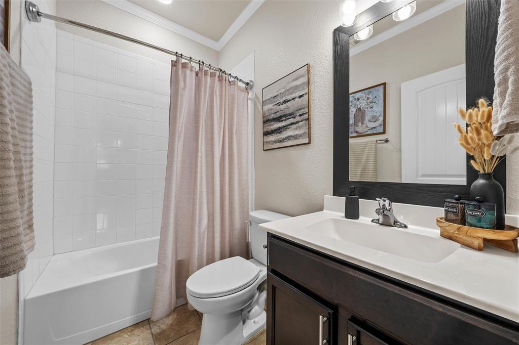 5801 Beckon Waco, TX 76708 - Photo 15 of 37 a bathroom with a sink a toilet and shower