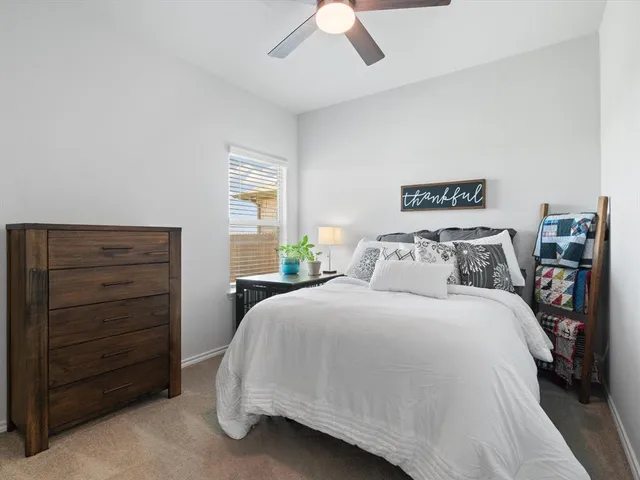 a bedroom with a bed and a cabinets