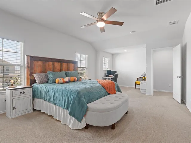 a bed room with bed and window