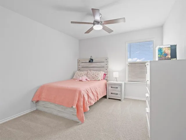 a bedroom with a bed and a walk in closet