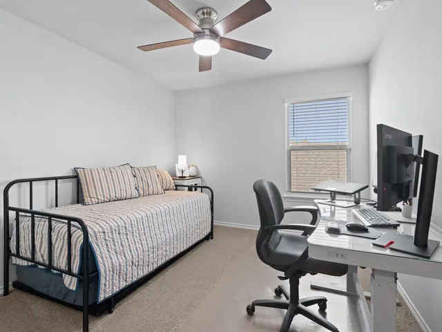 a view of a workspace with furniture