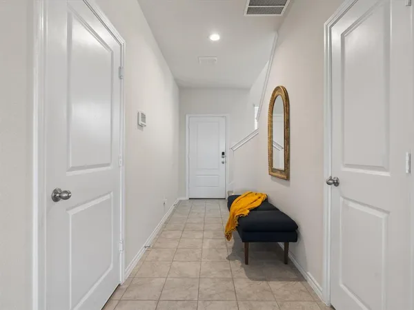 a bedroom with a bed and a lamp