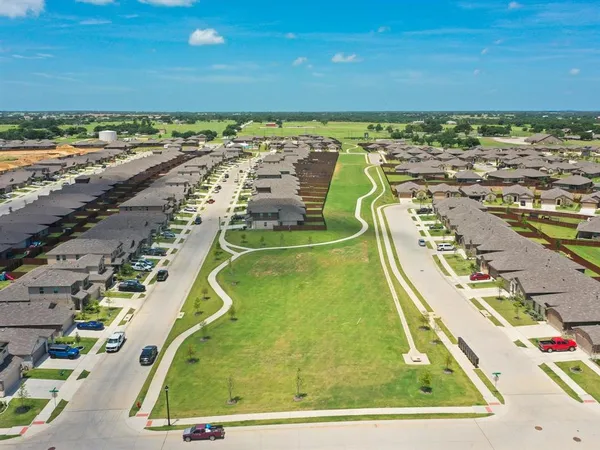 an aerial view of a house with a garden