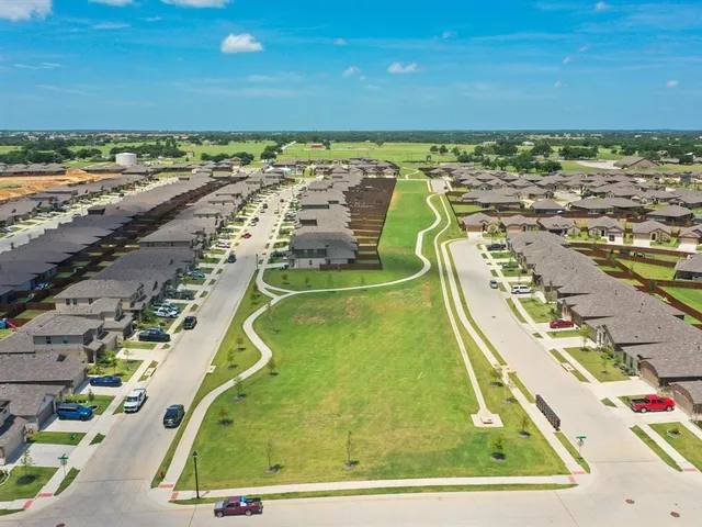 an aerial view of a house with a garden
