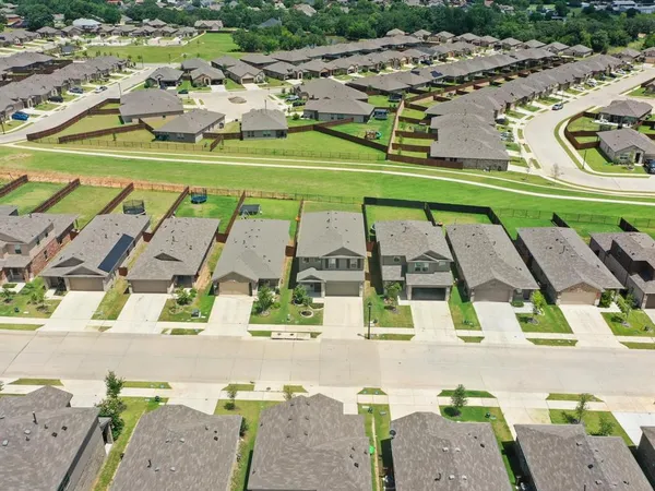 an aerial view of a house with outdoor space