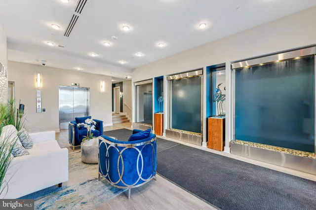 a living room with lots of furniture and white doors