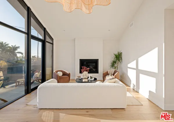 a bedroom with a large bed and a large window