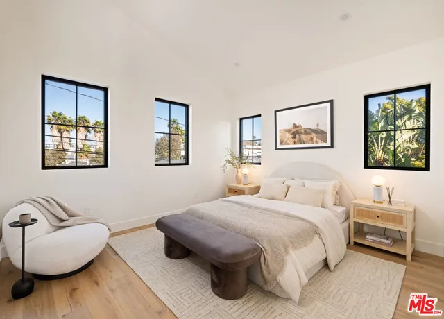 a bedroom with a bed and a couch