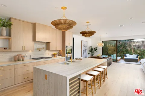 a kitchen with a table and chairs