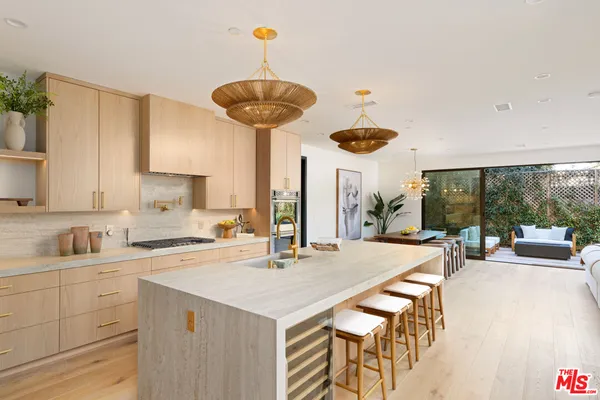 a kitchen with a table and chairs