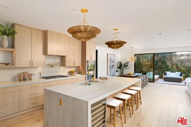 a kitchen with a table and chairs