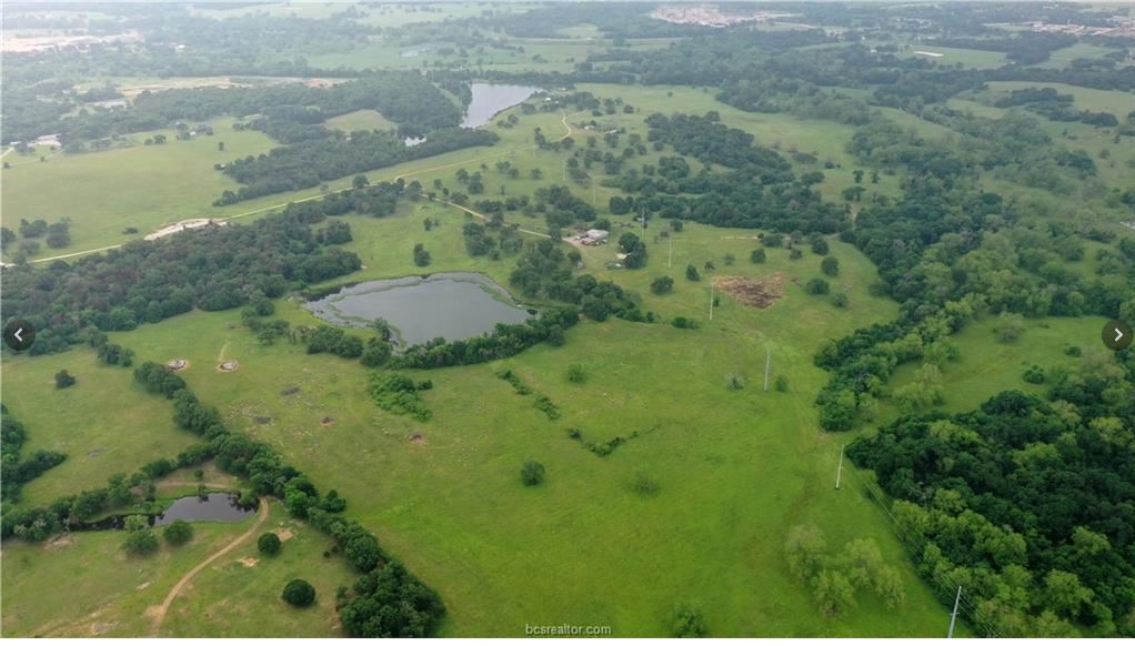 4342 A Dobrovolny Road Bryan, TX 77807 - Photo 6 of 6 a view of a lake with a yard
