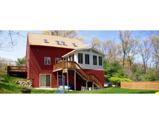 140 Rattlesnake Hill Road Andover, MA 01810 - Photo 2 of 11 a balcony with a table and chairs