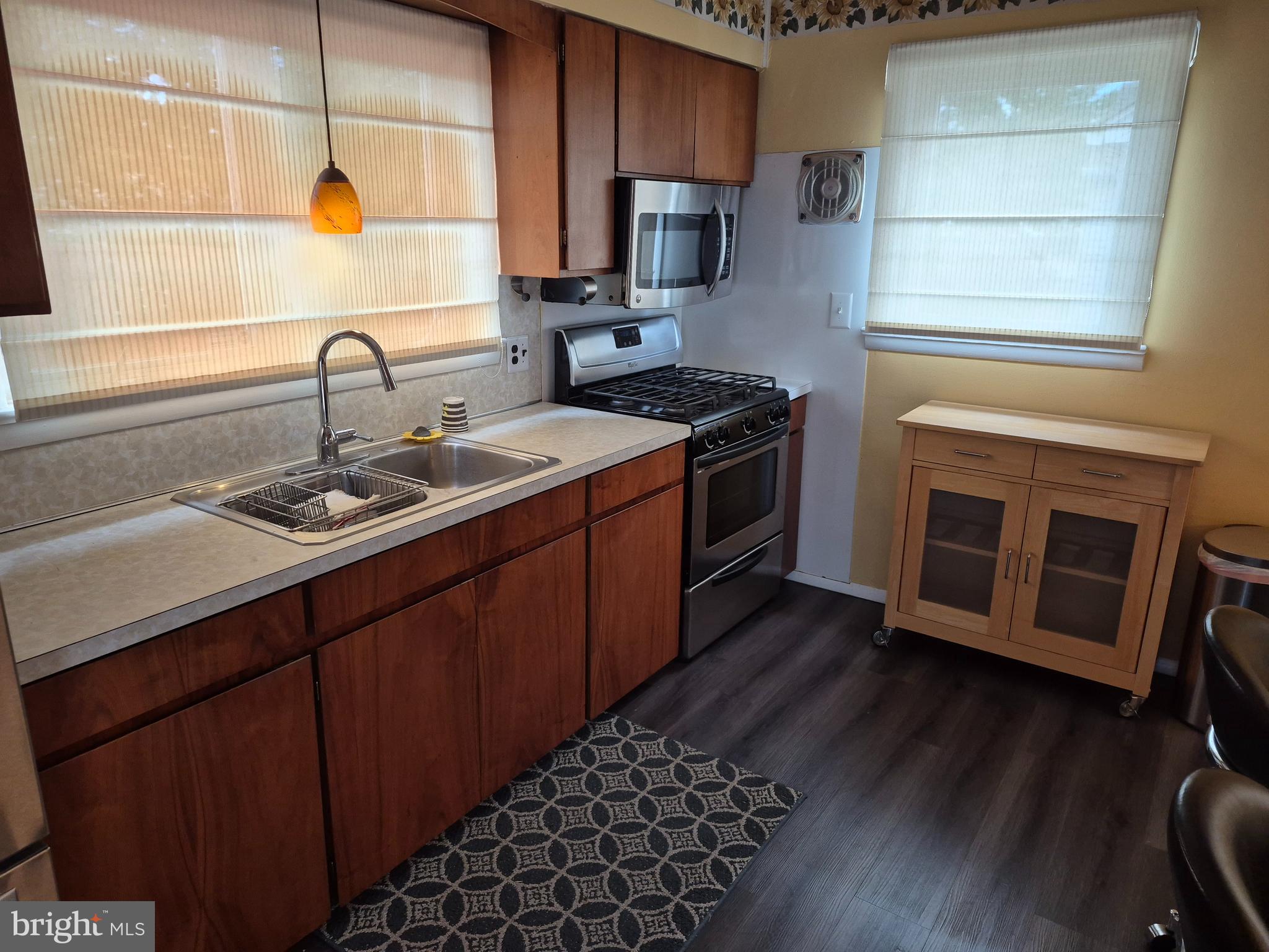 304 Lippincott Avenue Riverside, NJ 08075 - Photo 11 of 33 a kitchen with stainless steel appliances granite countertop a sink stove and wooden floor