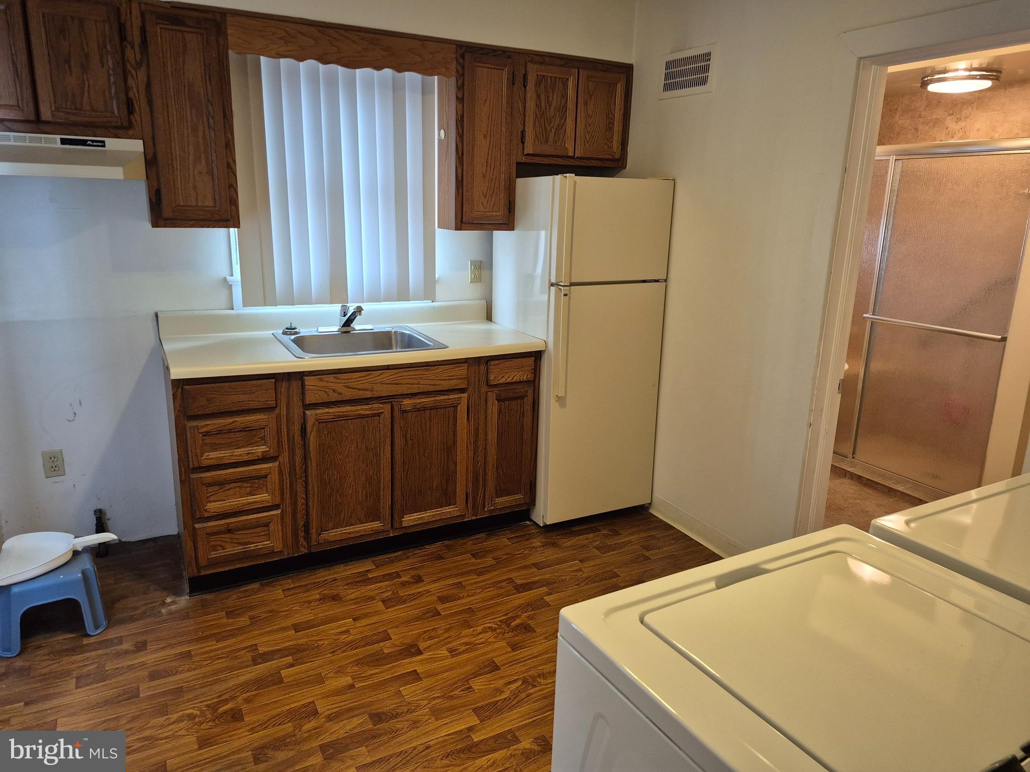 304 Lippincott Avenue Riverside, NJ 08075 - Photo 13 of 33 a kitchen with a refrigerator and a sink
