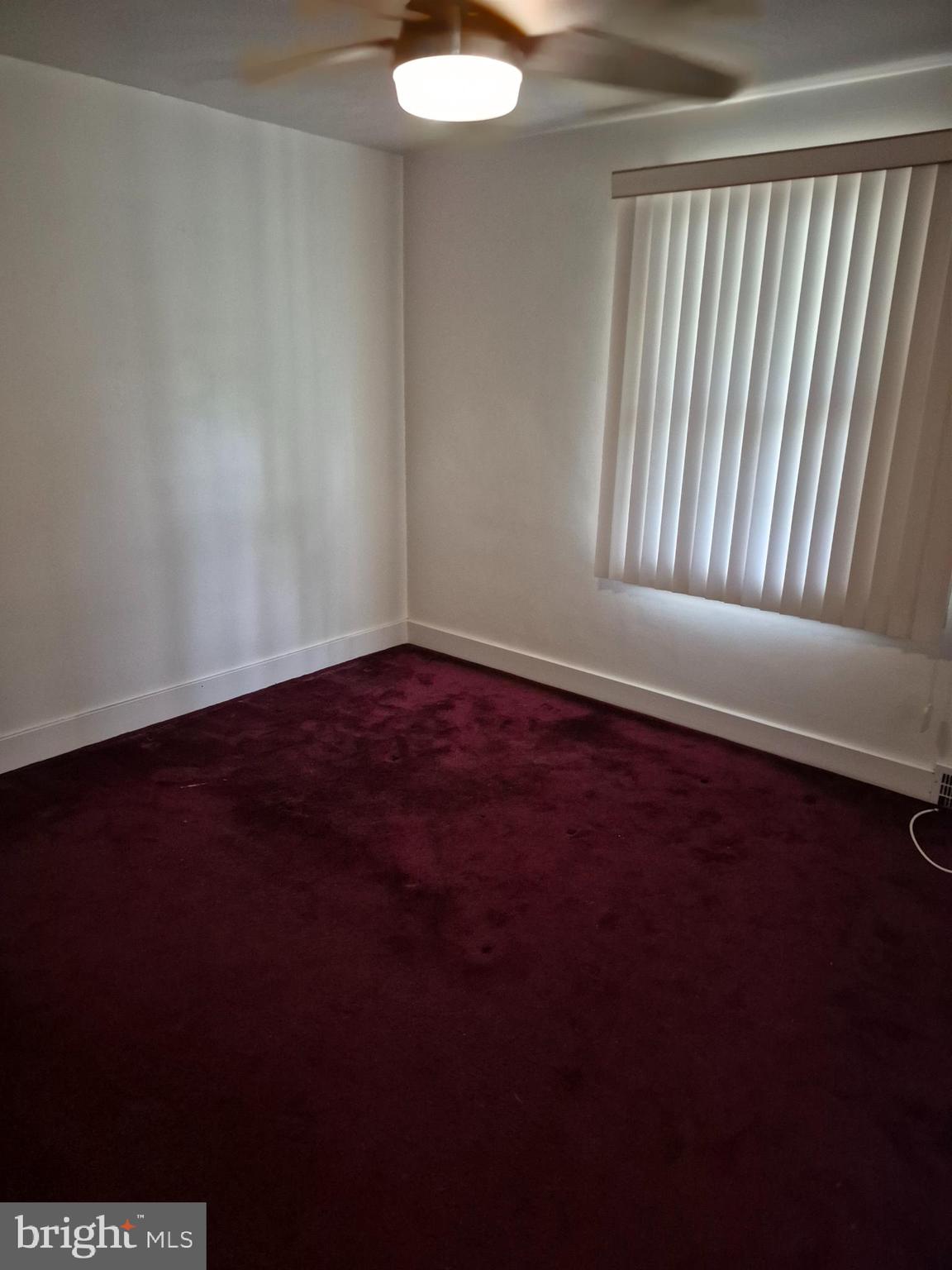 304 Lippincott Avenue Riverside, NJ 08075 - Photo 15 of 33 a view of an empty room with wooden floor and a window