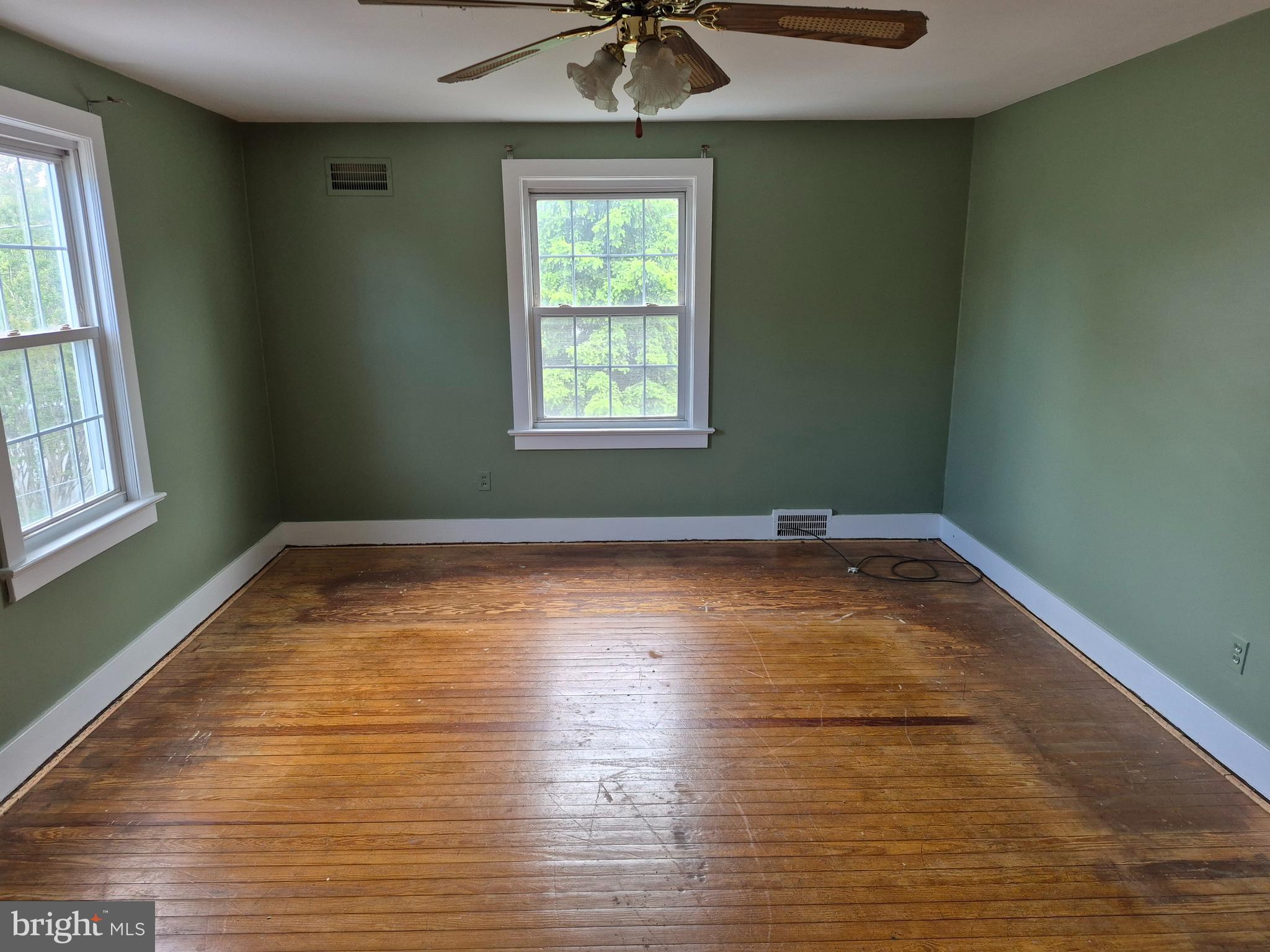 304 Lippincott Avenue Riverside, NJ 08075 - Photo 20 of 33 a view of empty room with wooden floor and fan