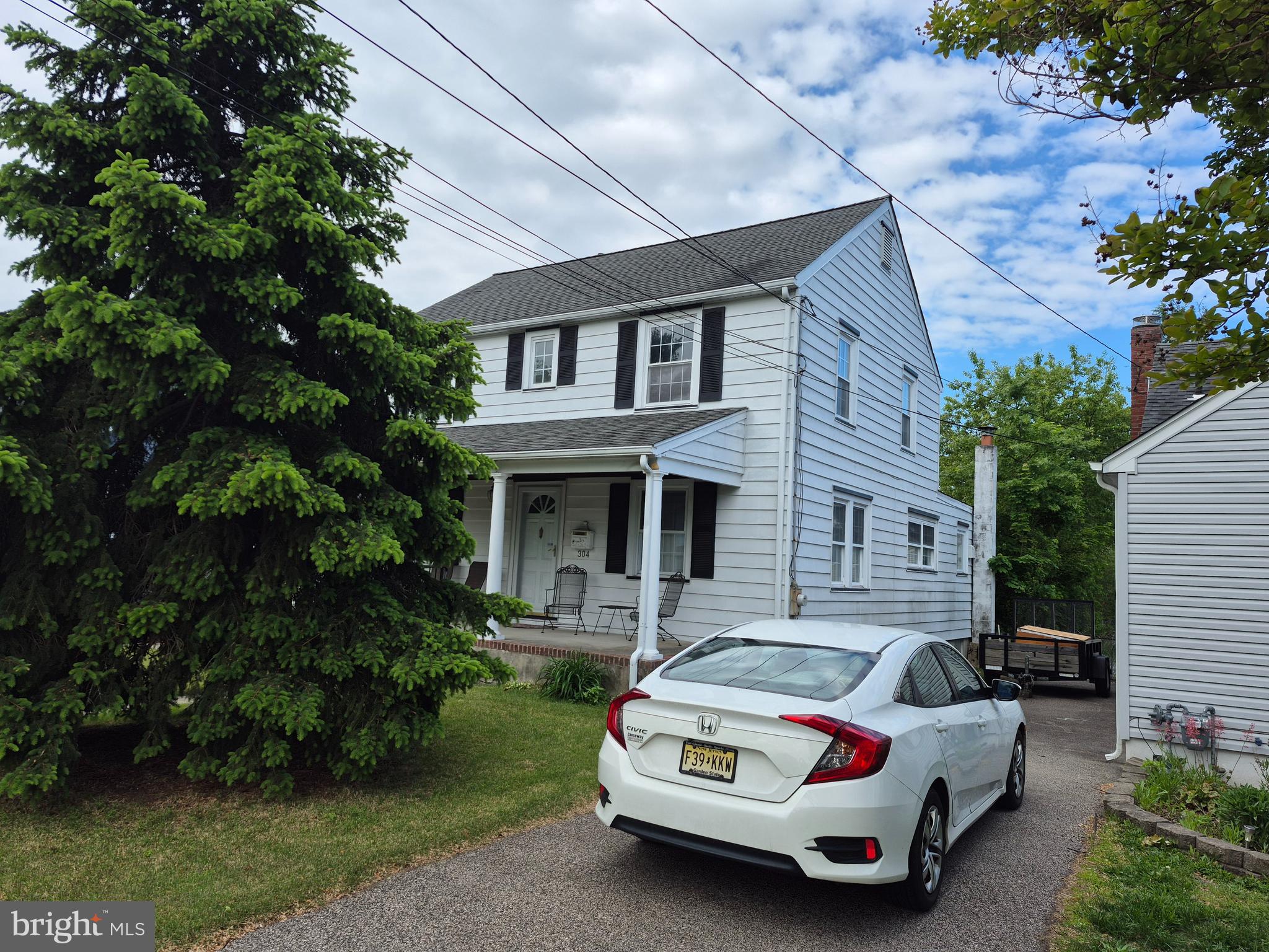 304 Lippincott Avenue Riverside, NJ 08075 - Photo 3 of 33 a car parked in front of a house