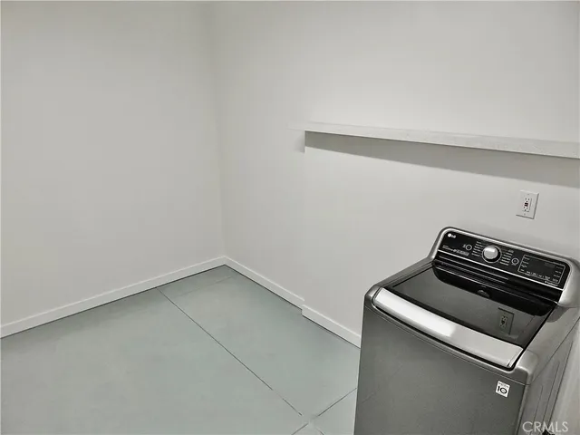 a utility room with washer and dryer