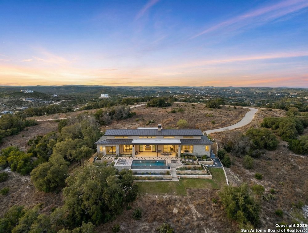 22977 Stallion Ridge San Antonio, TX 78255 - Photo 2 of 11 a view of a lake with mountains in the background
