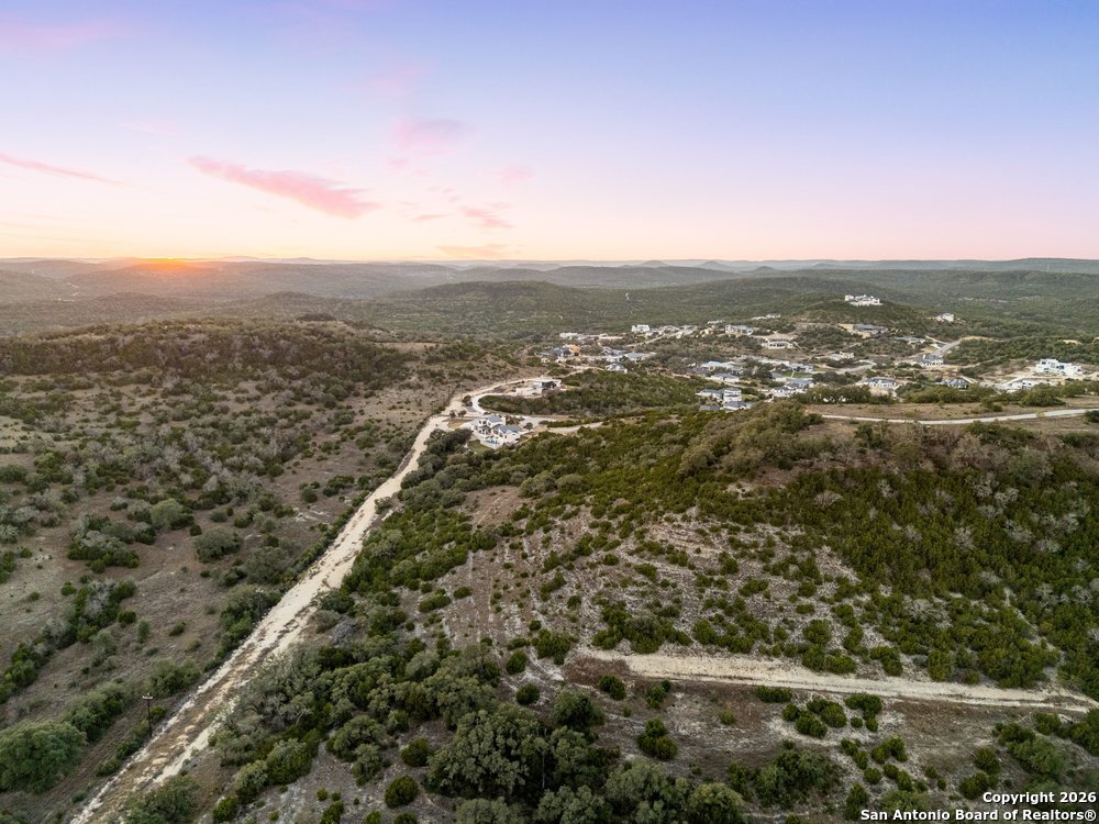 22977 Stallion Ridge San Antonio, TX 78255 - Photo 10 of 11 an aerial view of residential houses with city view