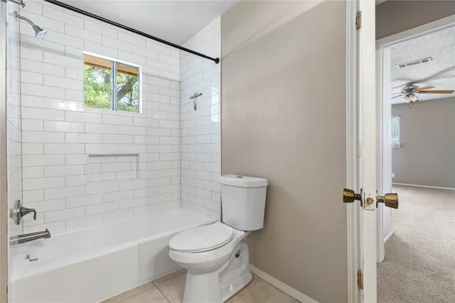 a bathroom with a toilet a sink and bathtub