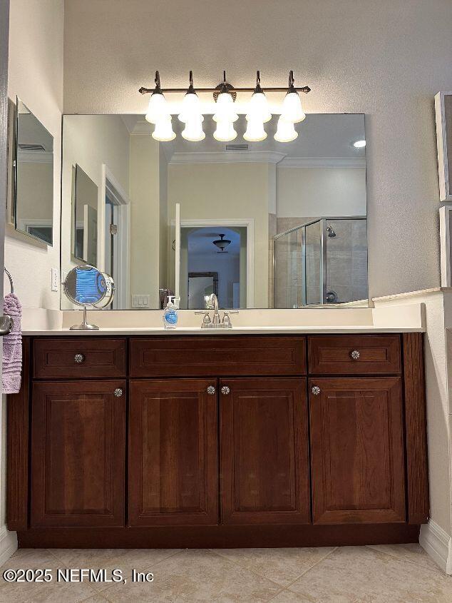 101 Hedgewood Drive St. Augustine, FL 32092 - Photo 11 of 27 a bathroom with a sink vanity and a mirror