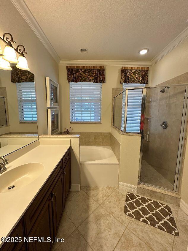 101 Hedgewood Drive St. Augustine, FL 32092 - Photo 12 of 27 a spacious bathroom with a tub sink and mirror