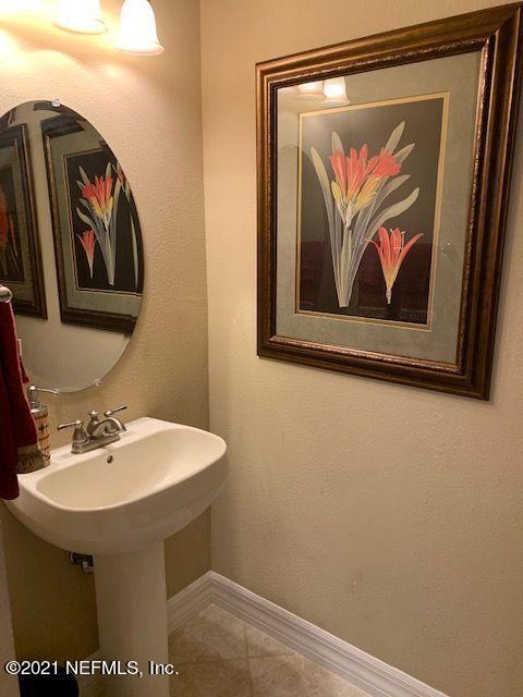 101 Hedgewood Drive St. Augustine, FL 32092 - Photo 14 of 27 a bathroom with a sink and a mirror