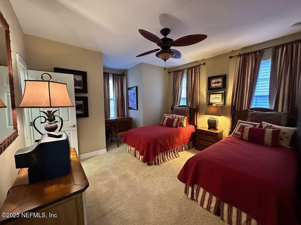 101 Hedgewood Drive St. Augustine, FL 32092 - Photo 16 of 27 a bedroom with two beds and a chandelier