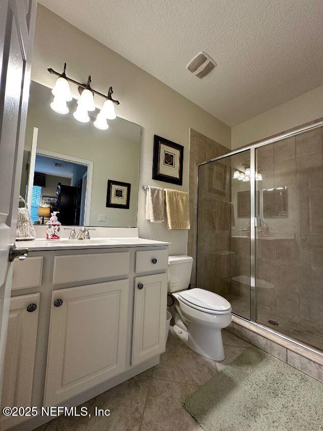 101 Hedgewood Drive St. Augustine, FL 32092 - Photo 18 of 27 a bathroom with a sink toilet and shower