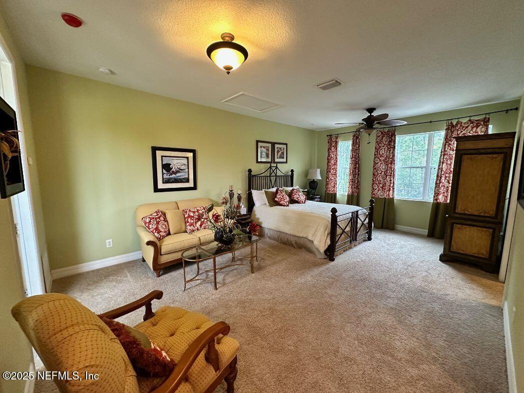 101 Hedgewood Drive St. Augustine, FL 32092 - Photo 19 of 27 a living room with furniture and a flat screen tv