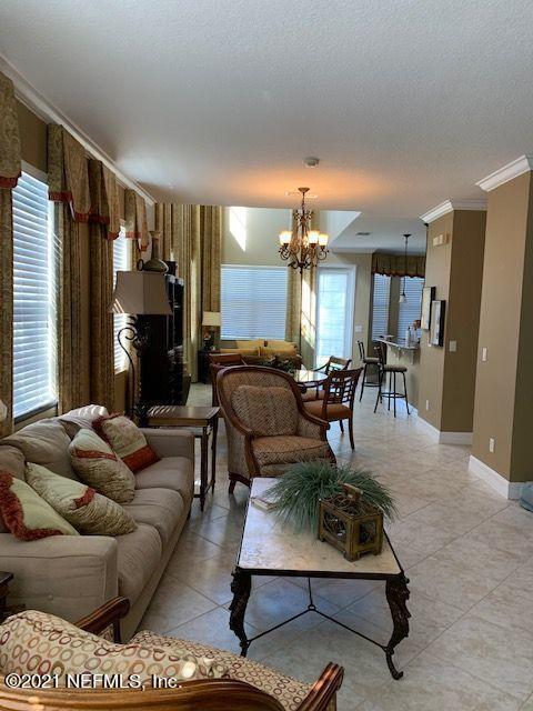 101 Hedgewood Drive St. Augustine, FL 32092 - Photo 2 of 27 a living room with furniture and a fireplace
