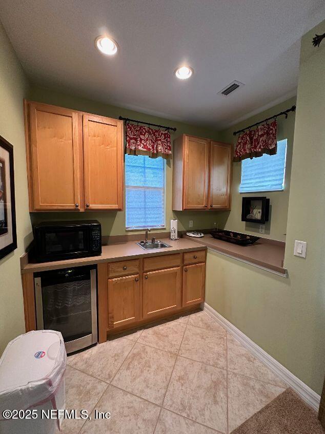101 Hedgewood Drive St. Augustine, FL 32092 - Photo 21 of 27 a kitchen with a stove a sink and a microwave